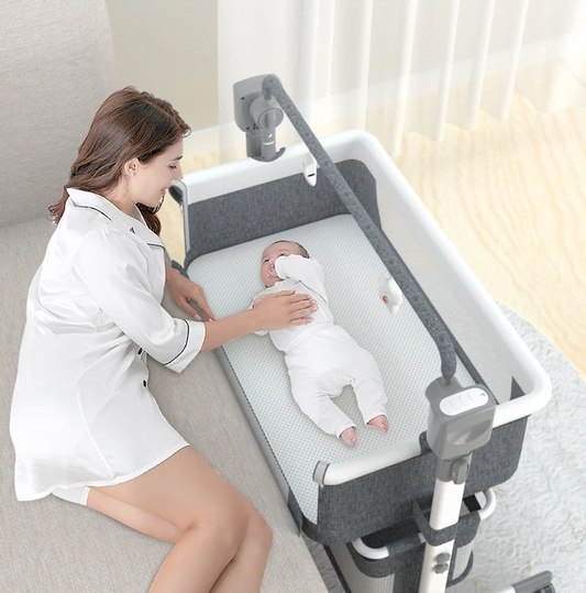 Co-sleeping electric rocking baby bed/cradle with remote control. 