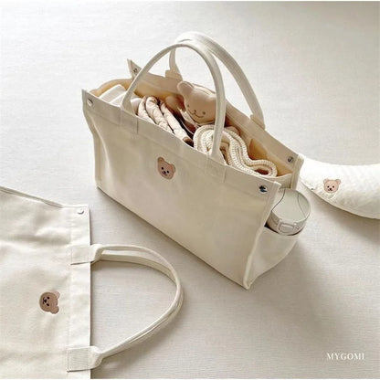 Carry bag for baby utensil storage.